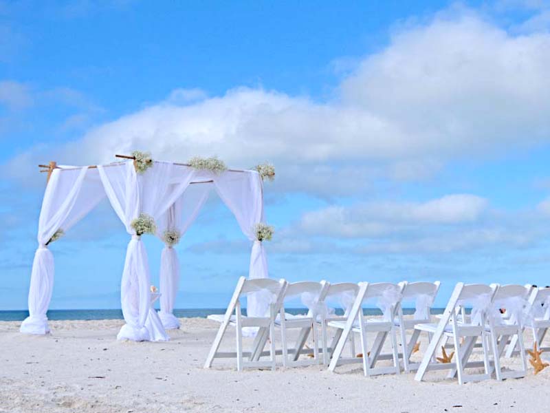 baby's breath beach wedding theme with arch accents