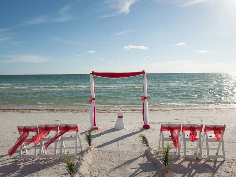 Red beach wedding theme